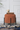 Terracotta Ribbed Round Ottoman with Black Legs