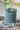 Compact Blue Upholstered Pouffe Chair with Backrest